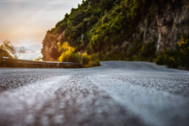 Sunset on the road near sea