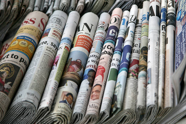Indian News Paper Various Indian News Papers' are displayed at a road side shop in New Delhi, India. newspaper stock pictures, royalty-free photos & images