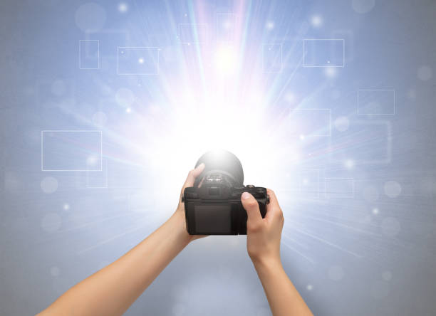 istock Hand taking photo with glowing flash concept 1158787213