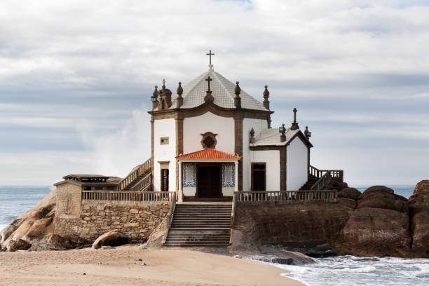 istock White Chapel Senhor da Pedra on rocks 1158789188