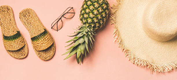 istock Variety of summer apparel items and fresh pinapple, wide composition 1158789685