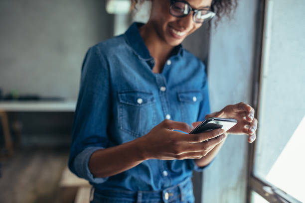 istock Female entrepreneur using smart phone in office 1158792262