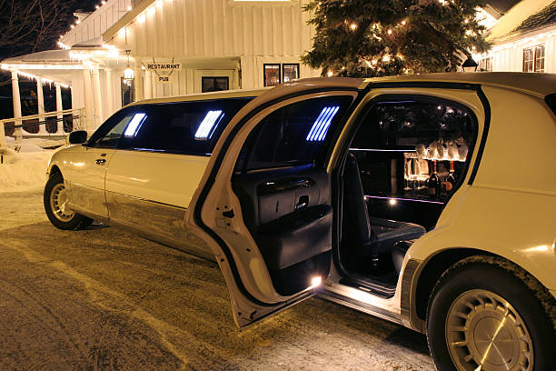 Your limo is waiting Your limo is waiting - Don't drink and drive - Bottles of bubbly visible inside the limo - Restaurant and Pub signs visible in the background. stag night stock pictures, royalty-free photos & images