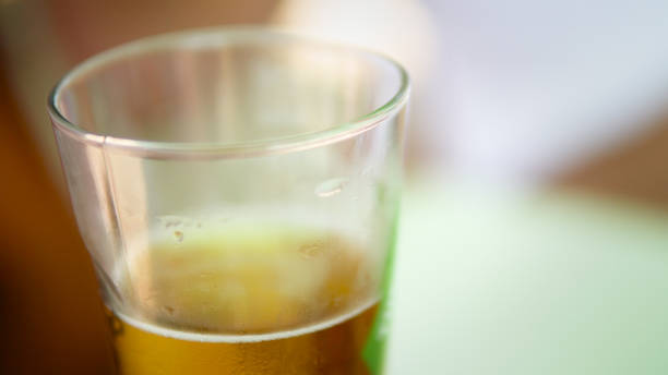 istock Selective focus of fresh cold beer pouring in glass 1158794356