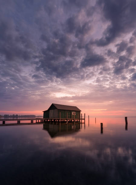 istock House by the lake with clouds 1158794594