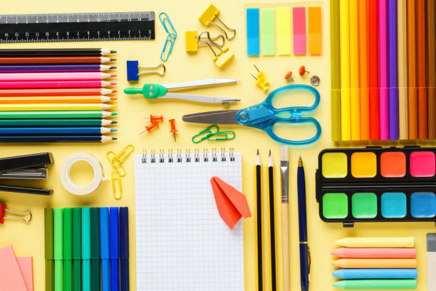 istock Flat lay composition with school stationery on yellow background 1158797260