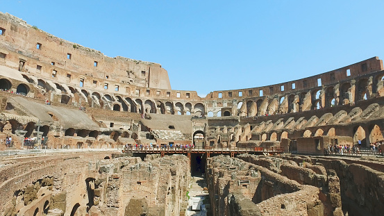 Inner part of Colosseum, people. Ancient landmark of Rome