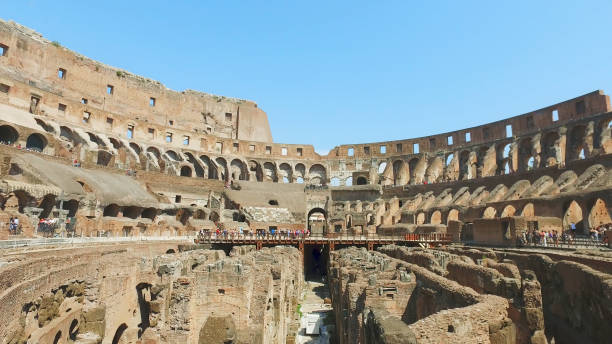 Inner part of Colosseum, people. Ancient landmark of Rome stock photo