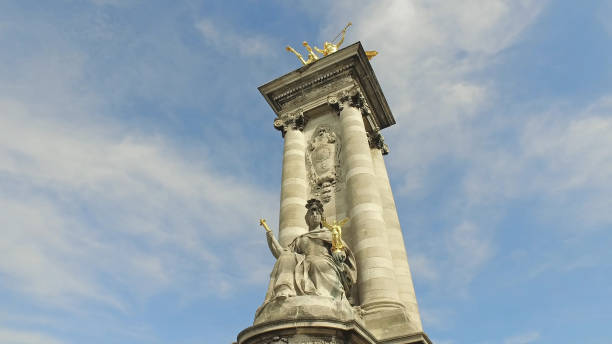 istock Paris Alexander III Bridge, Golden Statue Closeup View on a Blue Sky 1158797486
