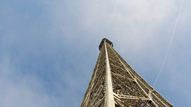 istock Eiffel tower top peak at sunny day and blue sky, cinematic 1158797560