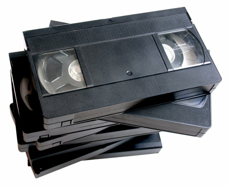 A stack of old VHS VCR video cassettes (clipping path included).