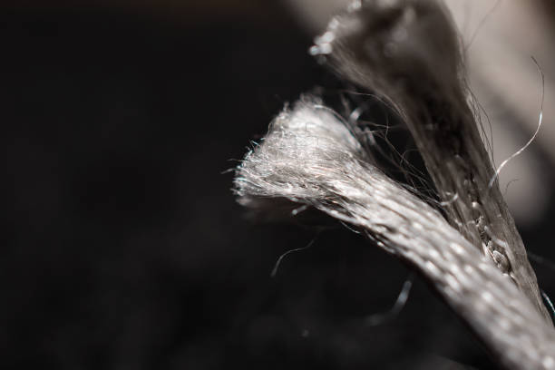 istock Delicate Synthetic White Fibers On Black Background 1158798542