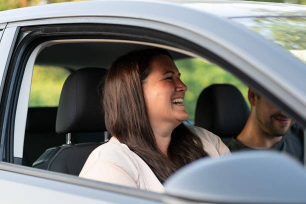 istock Young happy german woman smiling in the car 1158802480