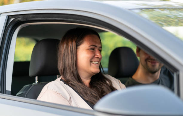 istock Young happy german woman smiling in the car 1158802489