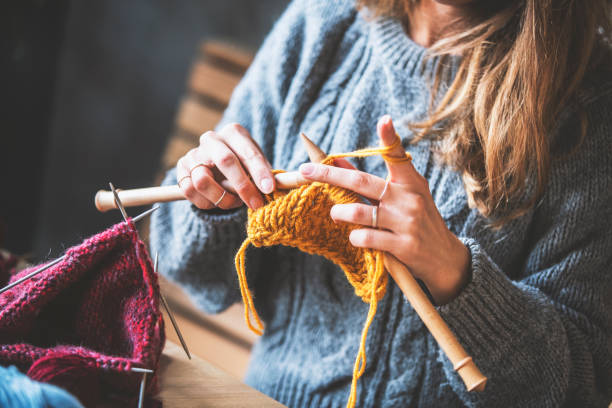 istock Close up on woman's hands knitting 1158804929