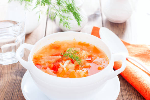 istock vegetable soup with onions and cabbage for onion diets in a white bowl, horizontal 1158805042