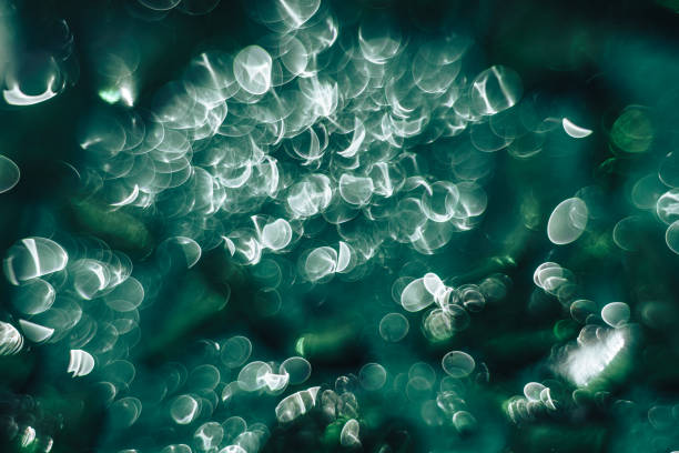 istock Beautiful light bokeh on a green background. 1158805088