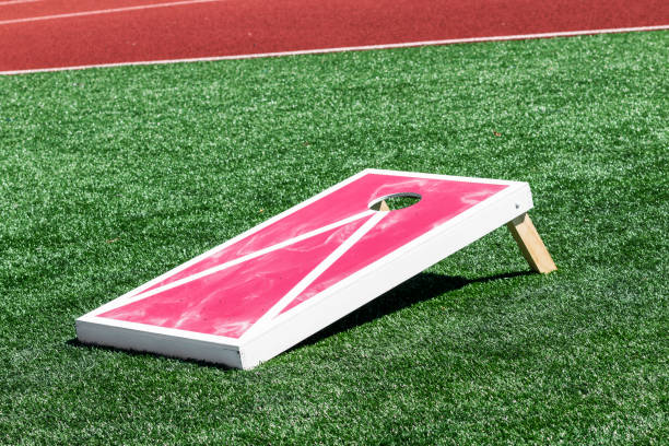 istock Side view of a red and white corn hole game board 1158806364