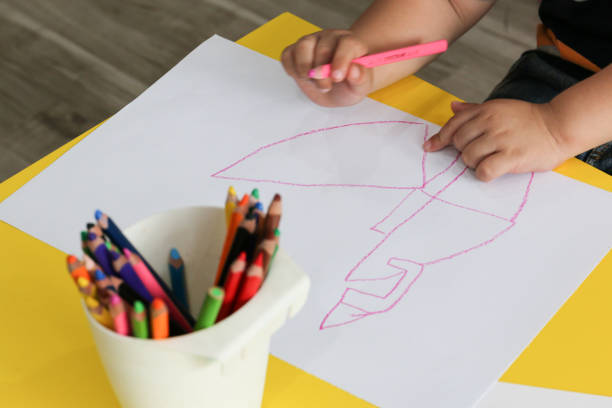 istock pink line was drawn by a kid on white paper 1158808250