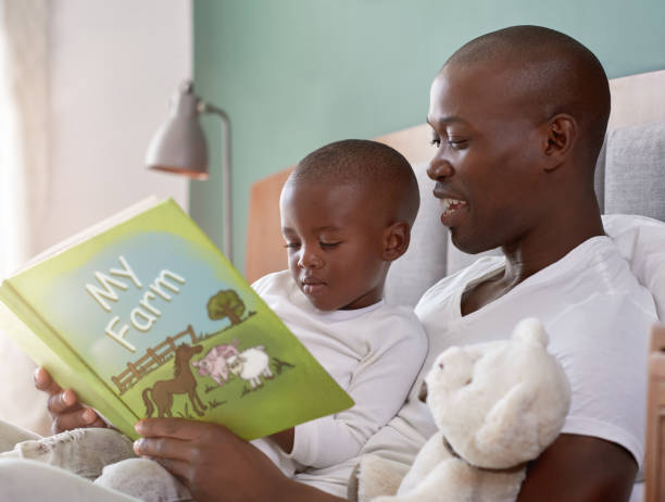 istock Dad reading bedtime stories to son 1158810486
