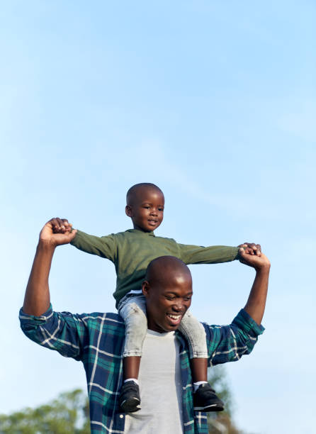 istock Happy father and son having fun outdoors 1158810583