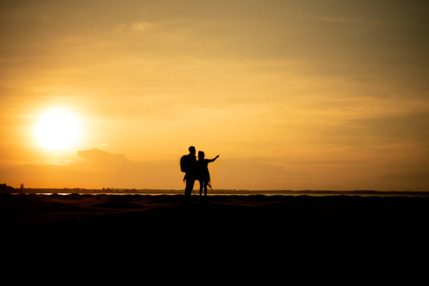 istock Silhouette traveler couples walking 1158815190