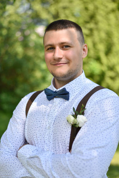 istock Groom in shirt in summer park 1158815217