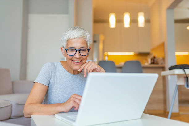 istock Woman Working From Home On Laptop In Modern Apartment 1158815225