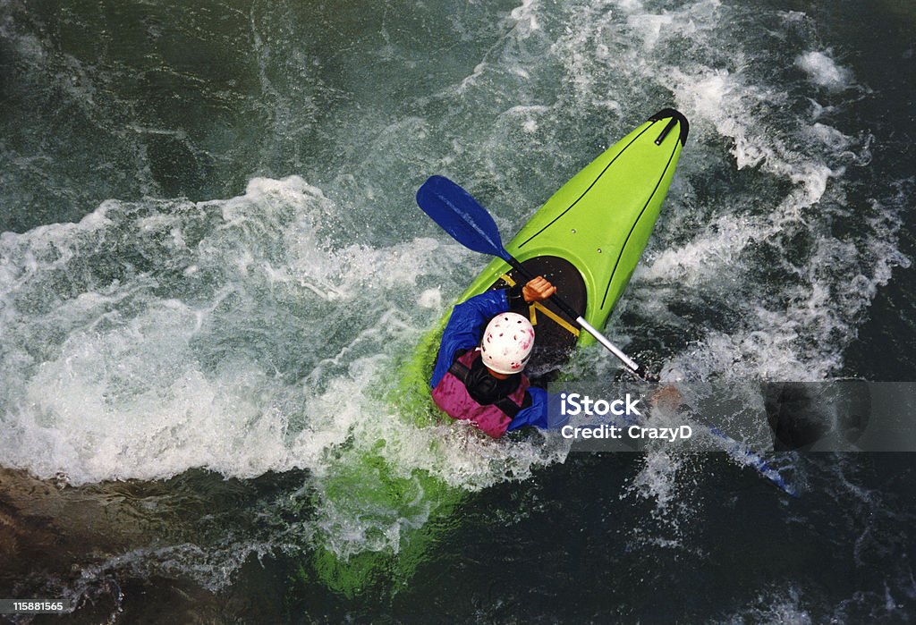 A shot of someone kayaking in a river Kayaking at river Rhone - France. Analog capture. Activity Stock Photo