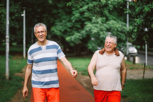istock Smiling mature friends exercising together 1158816720