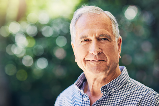 Shot of a confident senior man standing outdoors