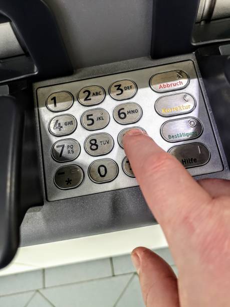 istock Hand enters a PIN Number into a bancomat 1158818641