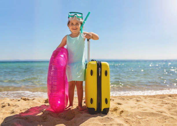 istock Cute tourist child enjoying the beach 1158819492