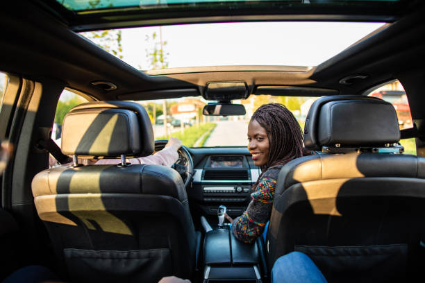 istock African woman looking over shoulder in a car 1158819593