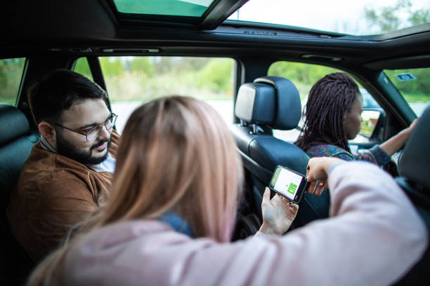 istock Cheerful friends having fun during ride sharing 1158819597