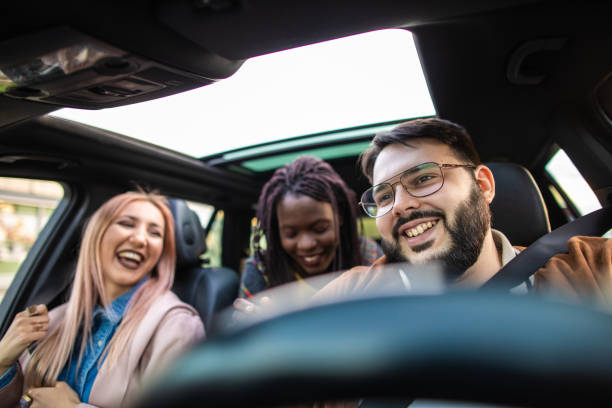 istock Multi-ethnic people driving in car 1158819639