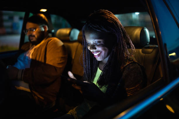 istock Multi-ethnic friends ride sharing at night 1158819814