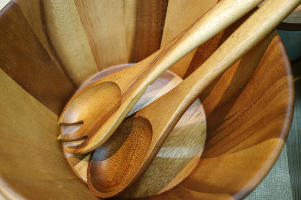 istock Wooden salad server spoon and fork in a wooden salad bowl 1158819829