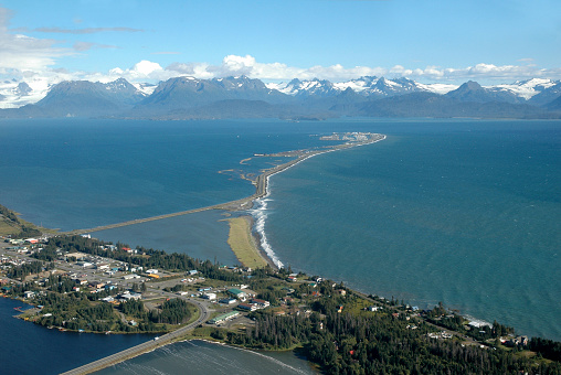 Homer is a town located on the shore of Kachemak Bay in  the Kenai Peninsula. The Homer Spit is a 7 km long gravel road leading to Homer Harbour.