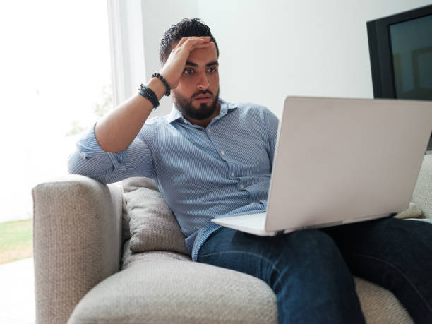 istock Distressed businessman staring at laptop 1158821981