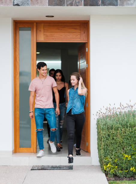 istock Young people going outside of a house 1158822025