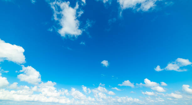 istock blue sky with white, soft clouds in the summer 1158822978