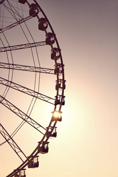 istock Silhouette of a Ferris wheel at sunset. 1158824165