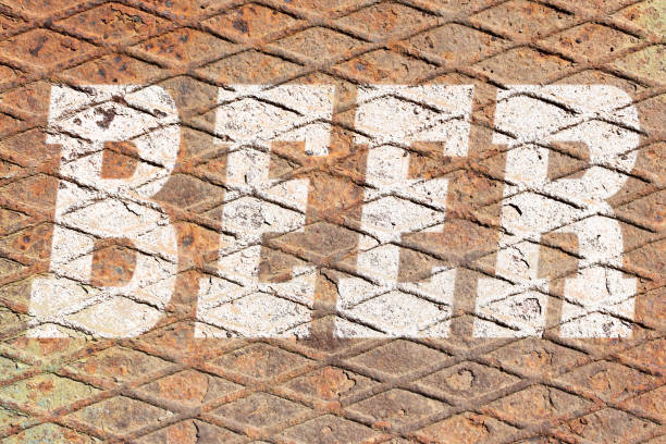 istock Word BEER on rusty metal texture background 1158824329