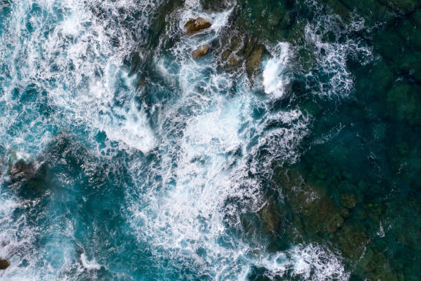 istock Rough sea waters with rocks and waves 1158825800
