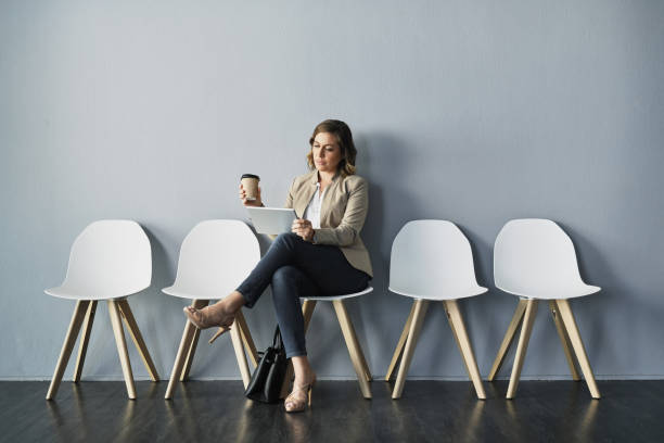 istock Coffee in one hand, schedule in the other 1158827228