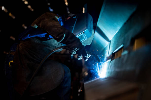 istock Operator welding at a metallurgic factory 1158830220