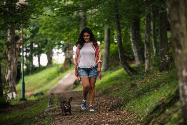 istock Beautiful woman with dog 1158832501