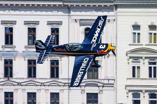 BUDAPEST / HUNGARY - JULY 4, 2015: Red Bull Air Race 2015 Challenger Class Extra 330 aircraft over Danube river in Budapest downtown