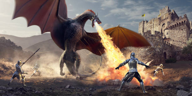 cavalieri medievali che combattono un enorme drago che respira il fuoco vicino al castello - fermo immagine effetti fotografici foto e immagini stock